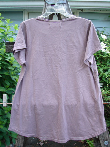 Barclay NWT Cap Sleeved Travel Tee, in Rose Earth, features a rounded neckline, cap sleeves, A-line shape, and a unique single flower design, embodying Bluefishfinder.com's vintage artistic style.