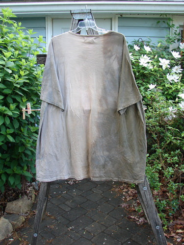 Barclay NWT Art Tee Mountain Dove Cafe Au Lait OSFA features a tunic length, drop shoulders, loose three-quarter sleeves, and a rounded neckline with a unique upward rounded front hem.