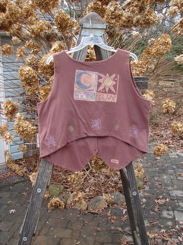1989 Folk Vest Sun Moon Paprika OSFA on a hanger, featuring mixed buttons, tuxedo tails, and vibrant sun and moon design on thick double-layered cotton.