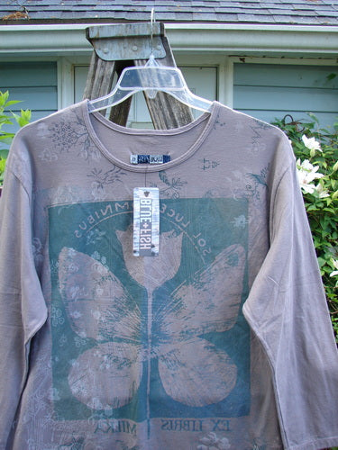 Barclay NWT Long Sleeved Studio Tee Floral Wing Mauve Aurore Size 0, featuring a straight shape, rounded neckline, and cozy long sleeves with a floral wing theme, ideal for creative expression.