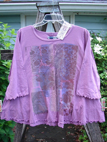 Barclay NWT Three Quarter Sleeved Cafe Tee in Quad Garden Pink Orchid, featuring a rounded, rolled neckline, A-line shape, and sweet curly edgings, exemplifies Blue Fish Clothing's vintage-inspired, creative design.