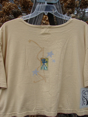 2000 Short Sleeved Crop Tee Flamingo Plantain Size 2 with playful flamingo painting, wide swingy lower shape, and softly rolled neckline, featuring the signature Blue Fish Patch 2k.