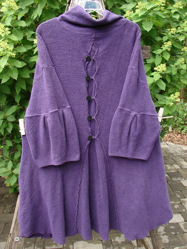 Barclay Patched Celtic Moss Double Snap Button Back Coat Violet OSFA features an A-line silhouette, bell sleeves, stand-up collar, scalloped edging, and double front snap buttons, captured hanging outdoors.