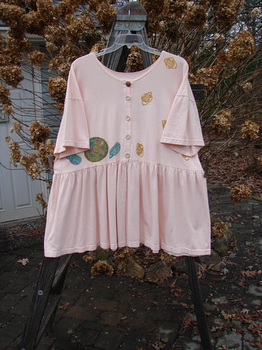 1992 Studio Cardigan Dress Breakfast Diner Sea Shell OSFA displayed on a swing, featuring a whimsical breakfast diner theme with original vintage buttons and a flouncy front vented lower.