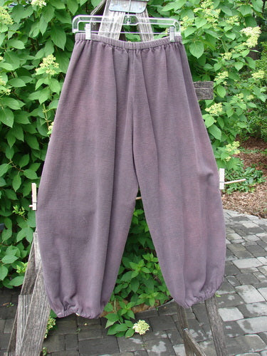 2000 Flannel Antoen Pant Unpainted Brum Size 1, displayed on a wooden trellis, features loose-fit, ankle-gathered design with replaced elastic waist and cuffs, highlighting Blue Fish Clothing's vintage style.