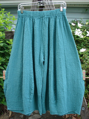 Barclay NWT Pucker Crop Mojo Pant in Unpainted Jade, showcasing a unique 3D diamond cut from knee down, with generous front pockets and thick elastic waistband, embodying Bluefishfinder's vintage, creative style.
