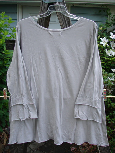 Barclay Cotton Lycra Petal Sleeved A Line Tunic Floral Dawn Flawed Birch Bark Size 1, featuring a rounded neckline, generous A-line shape, and unique petal sleeves, showcasing a blue dye transfer flaw.