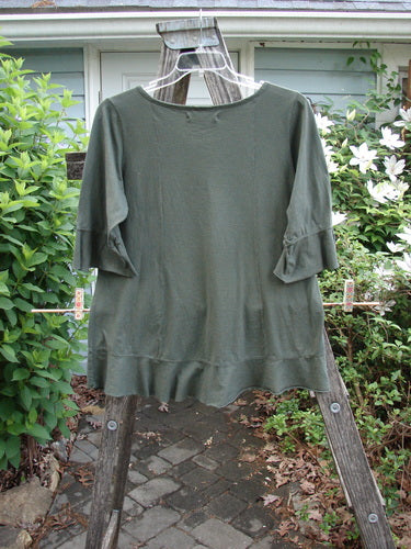 Barclay Three Quarter Sleeved Flutter Top Tulip Hunter Size 1 featuring a soft A-line shape, rounded sleeves, and hem flutter, showcasing a unique tulip paint design, perfect for expressing individuality.