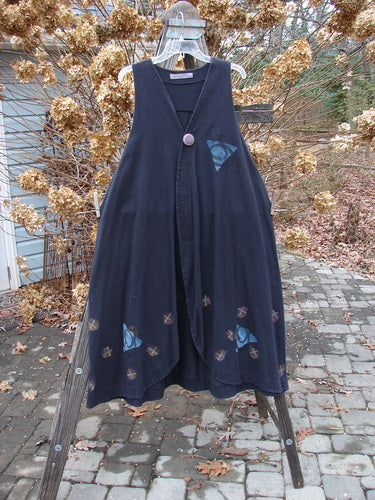 1996 State Fair Vest Tri Moon Storm Size 1 displayed on a rack, featuring a single oversized button, double paneled hemline, raised shoulder seam, wide A-line shape, and artistic triple moon design.