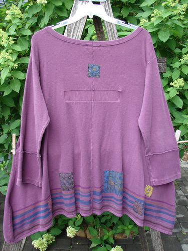 Barclay Patched Thermal Single Button Cardigan Tiny Square Murple Size 1 features a loose fit, flared sleeves, and patch details. It hangs on a rustic ladder, showcasing its artistic design.