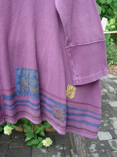 Barclay Patched Thermal Single Button Cardigan Tiny Square Murple Size 1, displayed draped over a wooden bench, features colorful patches, horizontal stripes, and distinctive curved stitchery detail.