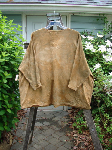 Barclay Cotton Lycra Writer's Pocket Pullover Sweatshirt in Mottled Mustard, featuring a seamless front and back, dual drop pockets, and floral theme paint, with a rounded neckline and stretchy sleeves.