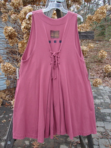 1997 Fresco Vest Structure Fascia OSFA hanging on a clothesline, featuring deep side pockets, oversized front buttons, adjustable lace, and a wide swingy A-line shape with a varying hemline.