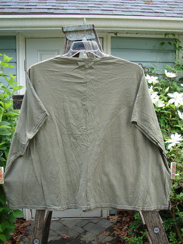 Barclay Cricket Cap Sleeve Tee Script Garden Bottlecap OSFA, showcasing cap sleeves, a boxy shape, seamless shoulders, and a rounded hemline, epitomizes Bluefishfinder.com's vintage-inspired, individualistic style.
