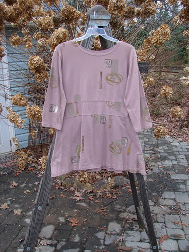 1991 Workshop Dress Spin Stone Currant OSFA displayed on a swinger, showcasing its tailored fit with a 4-inch drop waistband, double front and back pleats, and a slightly shallow scooped neckline.