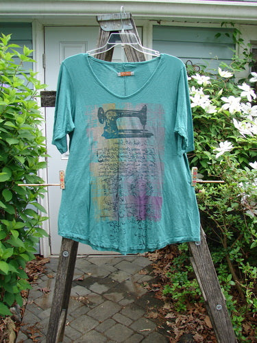 Barclay Slub Curve Bottom Tee Singer Seamstress Spearmint Size 1 features a rounded neckline, short sleeves, A-line shape, and varying hemline, embodying BlueFishFinder's vintage, expressive, and creative style.