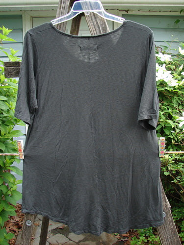 Barclay Slub Curve Bottom Tee Single Floral Black Size 1, featuring a rounded neckline, short sleeves, and an A-line shape with a distinctive varying hemline, embodying vintage Blue Fish Clothing's creative style.