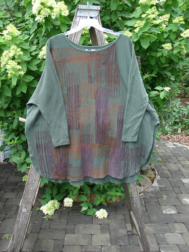 Barclay Thermal Monte Verde Vented Tunic draped on a ladder, showcasing a loose fit with abstract patterns and side vents, embodies Bluefishfinder.com's vintage, individualistic fashion ethos.