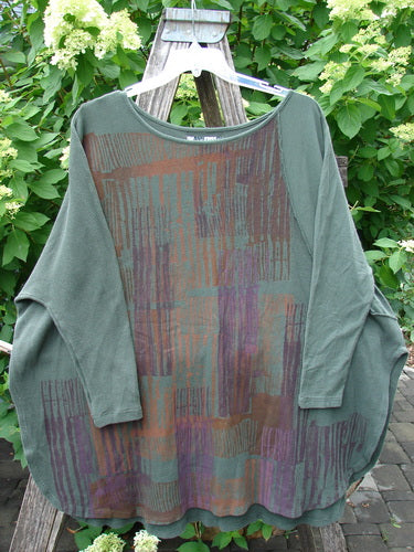 Barclay Thermal Monte Verde Vented Tunic Linear Blend Army OSFA hanging outdoors, showcasing its abstract block-pattern and side vents, embodying Bluefishfinder.com's vintage style and creative freedom ethos.