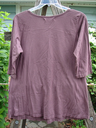 Barclay Three Quarter Sleeved Cafe Tee Water Lily Fig Size 1; features a rounded ribbed neckline, A-line shape, and water lily theme, crafted from organic cotton with three-quarter sleeves.