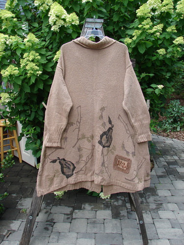1998 Cotton Knit Canyon Cardigan Sweater Coat Pear Harvest Aspen OSFA draped over a ladder, showcasing its ribbed cuffs, botanical prints, and distinctive clay button, embodying Bluefishfinder.com's vintage style and creative expression.