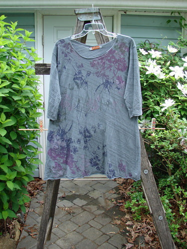 Barclay Viscose Three Quarter Sleeved Raw Cut Tee featuring a raw cut neckline and edgings, with a slight A-line shape and three-quarter sleeves, in a unique Dusk Garden Grey Striation design.