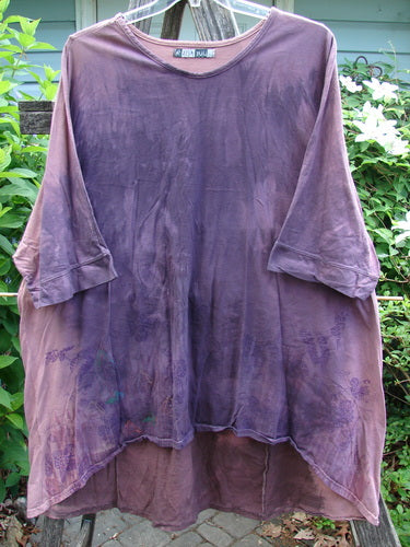 Barclay Banded Drawcord Art Top Paisley Patch Mottled Plum OSFA features a longer tunic length, drop shoulders, loose three-quarter sleeves, rounded neckline, and varying hemline with unique paisley patch detailing.