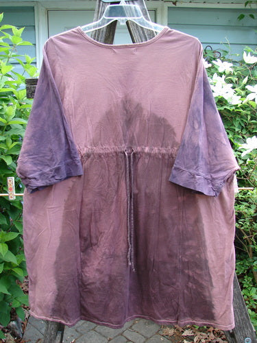 Barclay Banded Drawcord Art Top Paisley Patch Mottled Plum OSFA features a tunic length, drop shoulders, loose three-quarter sleeves, rounded neckline, varying hemline, and Tiny Village theme paisley patch.