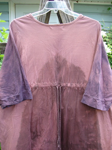 Barclay Banded Drawcord Art Top Paisley Patch Mottled Plum OSFA showcases a tunic-length design with drop shoulders, loose three-quarter sleeves, and a rounded neckline, featuring unique Tiny Village theme paint.