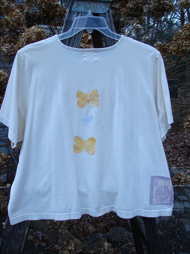 1999 Light Weight Short Sleeved Crop Tee Butterfly Natural Size 2, featuring a white base with butterfly motifs, short sleeves, a rounded neckline, and a boxy shape.