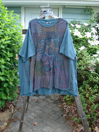 Barclay Art Tunic Stone Garden Mottled Green Mineral OSFA; features drop shoulders, loose three-quarter sleeves, a rounded neckline, and a unique hemline showcasing a vertical Victorian gate theme.