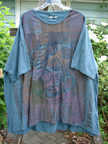 Barclay Art Tunic Stone Garden Mottled Green Mineral OSFA features a longer tunic length, drop shoulders, loose three-quarter sleeves, and a varying hemline with artistic vertical Victorian gate theme paint.