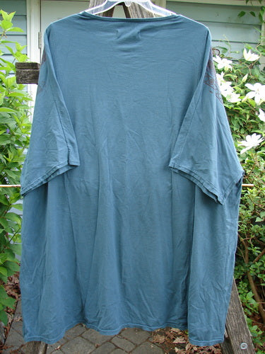 Barclay Art Tunic Stone Garden in Mottled Green Mineral OSFA, showcasing a longer tunic length, drop shoulders, loose three-quarter sleeves, rounded neckline, and varying hemline with upward rounded front.