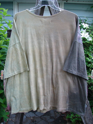 Barclay Short Sleeved Center Seam Square Pullover Garden Friends Mottled Mustard OSFA features a rounded neckline, short dolman sleeves, and a wide, boxy shape with a vertical center seam.