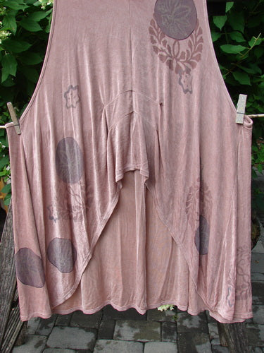 1999 Acetate Lycra Rosewater Sleeveless Pullover Circle Flower Rosetta OSFA hanging outdoors, showcasing its asymmetrical hem, deeper neckline, arm openings, and circle flower motifs, epitomizing vintage Blue Fish Clothing creativity.