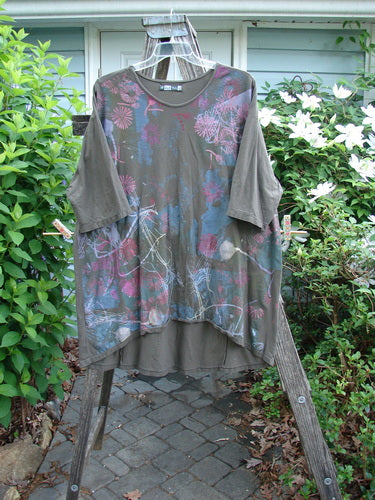 Barclay Tournesol Tunic Seed Pod Garden Stick OSFA showcases a tunic-length design with drop shoulders, loose three-quarter sleeves, a rounded neckline, and a varying hemline, featuring a garden theme motif.