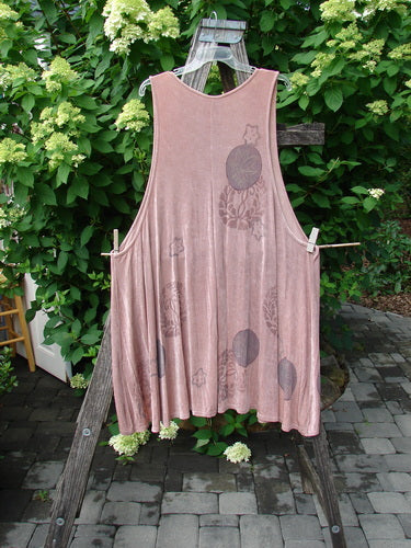 1999 Acetate Lycra Rosewater Sleeveless Pullover Circle Flower Rosetta OSFA draped on a wooden easel outdoors, showcasing its unique floral motifs, varying hemline, deeper neckline, and gathered pleated front insert.