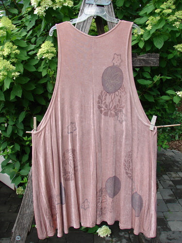 1999 Acetate Lycra Rosewater Sleeveless Pullover Circle Flower Rosetta OSFA displayed outdoors, showcasing its tunic style, deep V-shaped neckline, and floral medallion pattern. Features pleated front and varying hemline.