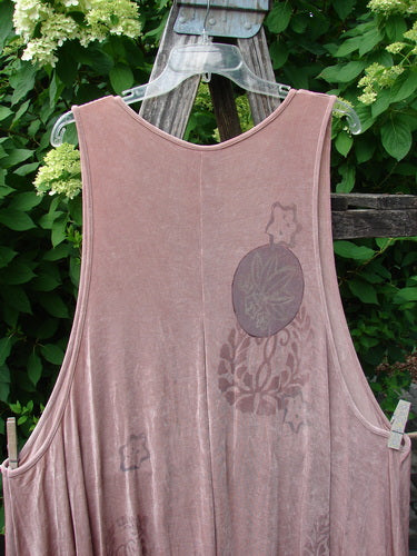 1999 Acetate Lycra Rosewater Sleeveless Pullover Circle Flower Rosetta OSFA hangs on a fence, showcasing a loose fit with circular floral motifs, deep V-neck, varying hemline, and gathered front insert.