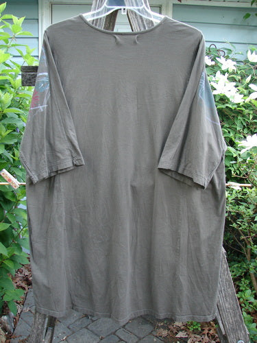 Barclay Tournesol Tunic Seed Pod Garden Stick OSFA features a loose, mid-length design with drop shoulders and three-quarter sleeves, showcasing a garden motif on organic cotton.