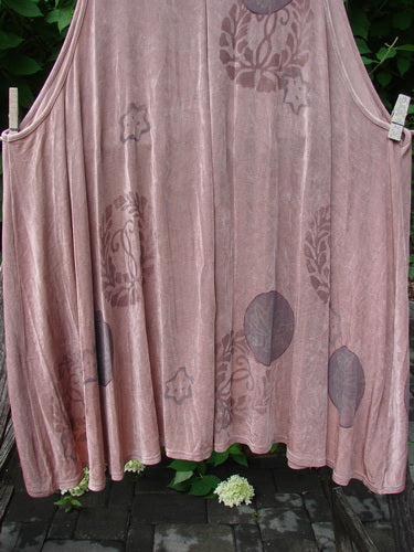 1999 Acetate Lycra Rosewater Sleeveless Pullover features a muted rose tone with large circular botanical prints, clipped outside. It's a vintage piece with a unique neckline and pleated front, embodying BlueFishFinder's creative ethos.