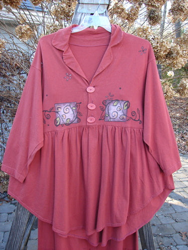 1997 Hearth Peplum Button Duo Vines Brick Size 2, featuring a deep V neckline, oversized pearl-like buttons, empire waist, gathered hemline, and garden vine theme paint on a red shirt and matching skirt.