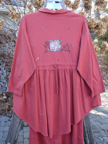 1997 Hearth Peplum Button Duo Vines Brick Size 2: Red jacket with deep V neckline, pearl-like buttons, empire waist, gathered hemline, vine-themed paint, and matching skirt with oversized buttons and elastic waist.