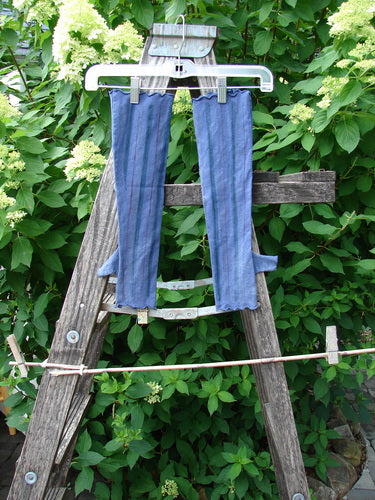 Barclay Cotton Lycra Hemp Fingerless Glove Stripe Royal Orchid OSFA draped on a hanger, clipped to a ladder outdoors, showcasing its long, stretchy sleeves with unique fingerless and thumb tunnel design.