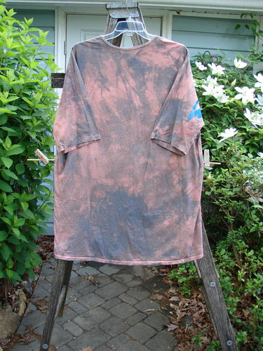 Barclay Tournesol Tunic Butterfly Love Mottled Sunset OSFA features a loose-fitting design with drop shoulders and three-quarter sleeves, showcasing a unique butterfly theme on a varied hemline.