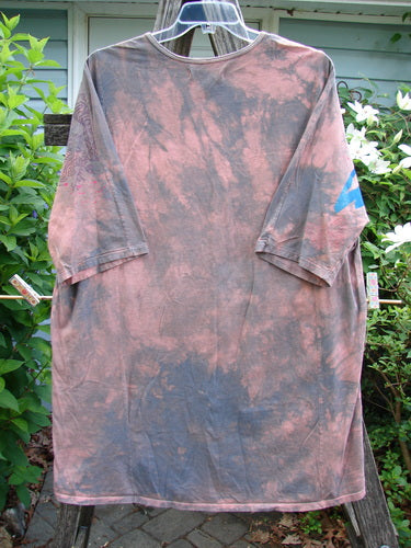 Barclay Tournesol Tunic Butterfly Love Mottled Sunset OSFA features a tunic length, drop shoulders, loose three-quarter sleeves, rounded neckline, and a varying hemline with a butterfly-themed design.