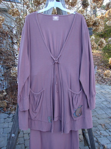 2000 Crepe Rennai Lindrel Duo Loam Size 2: A purple long cardigan and matching skirt with unique ties, pointed hems, and gathered cuffs.