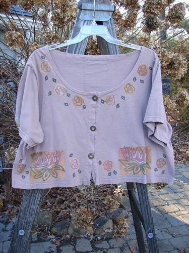 1993 Travel Top Lilly Pads Dried Rose Size 2 displayed on a hanger, featuring a deeply scooped neckline, cropped shape, water lily theme paint, and rare wooden buttons.