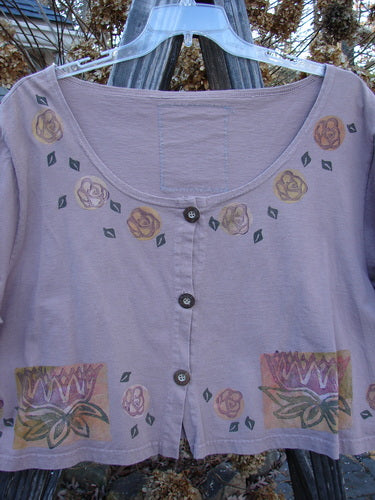 1993 Travel Top Lilly Pads Dried Rose Size 2: A purple shirt with floral patterns, deeply scooped neckline, cropped shape, and rare wooden buttons, ideal for layering and pairing with Blue Fish pieces.