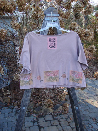 1993 Travel Top Lilly Pads Dried Rose Size 2 displayed on a hanger, featuring a deeply scooped neckline, cropped shape, water lily design, and wooden buttons.